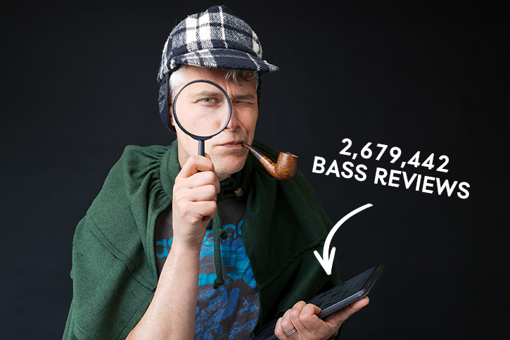 Internet sleuth bassist walking around the internet with a magnifying glass & Sherlock Holmes hat