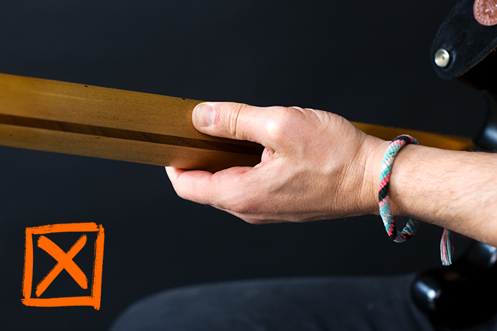 Image depicting the death grip on a bass neck