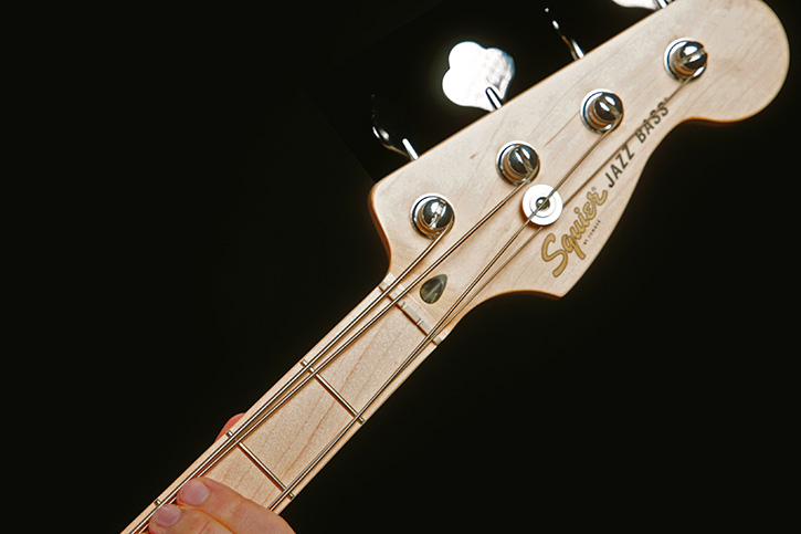 Picture of a bass with the A and D strings loosened
