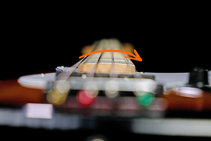 Picture highlighting the curve of the fingerboard