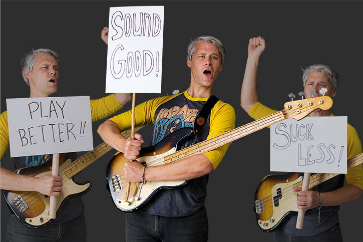 Image of several Gios holding a bass and protesting with signs
