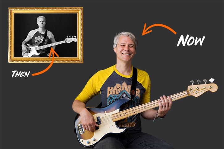 Picture of a very happy, smiling Gio holding a bass standing in front of a pictured frame of himself being sad